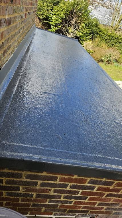 Close-up of the finished GRP surface and edge on a small flat roof